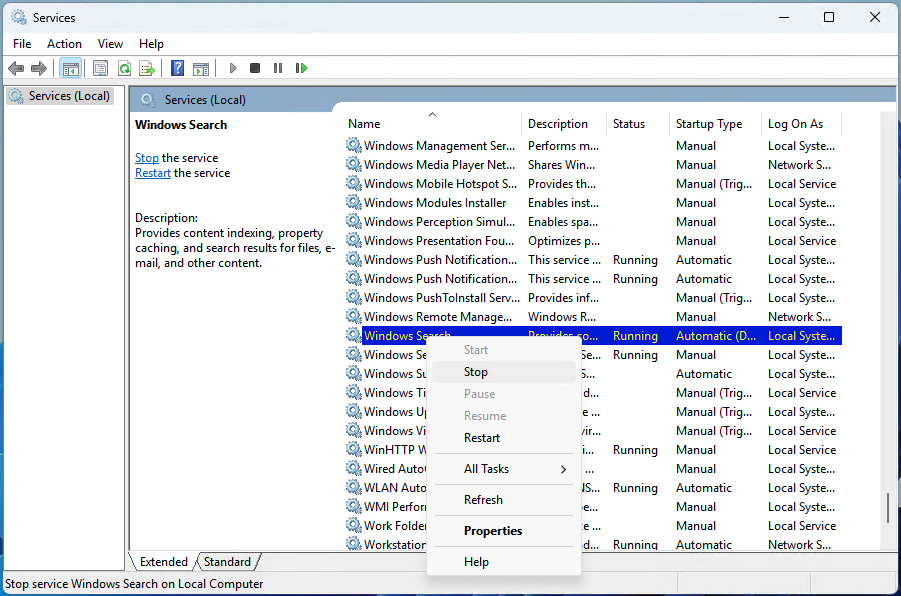 Right-click the Windows Search service and click Stop