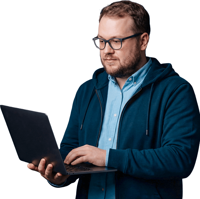 IT person on laptop happy because he's using NinjaOne