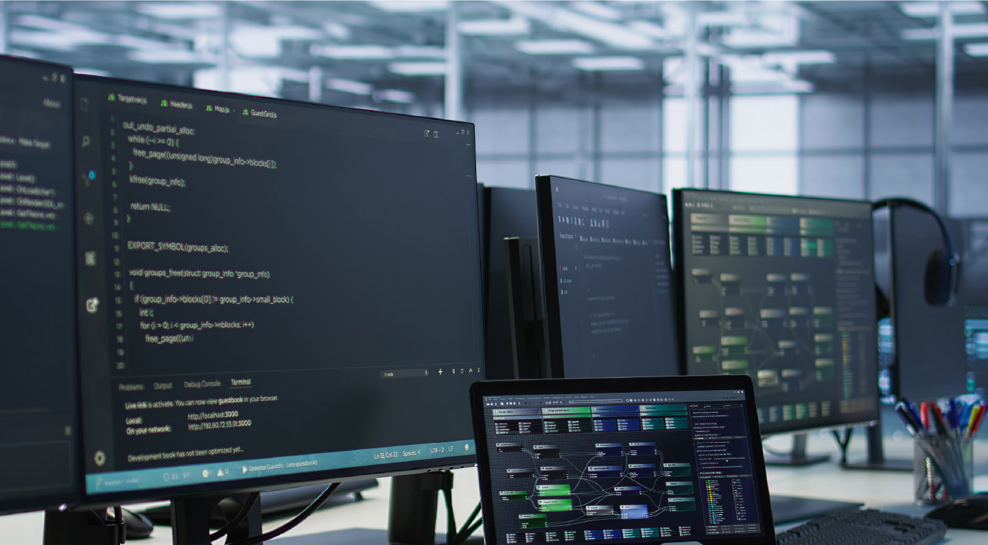 N1-0650 Sentree case study-Thumbnail Multiple monitors showing code and system dashboards